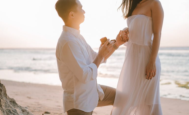 Beach proposal moment during a couple photography session at Anantara Uluwatu Bali Resort.