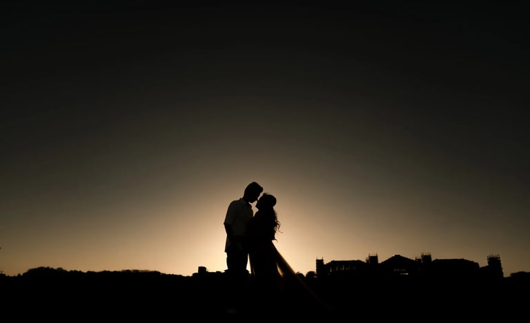 Silhouette couple photography during sunset at The Apurva Kempinski Bali beach