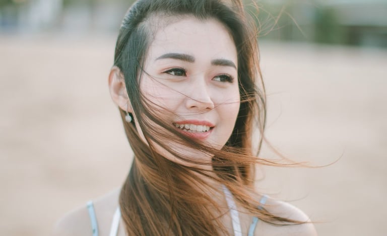 Female portrait during beach couple session at Sofitel Bali Nusa Dua Beach Resort.