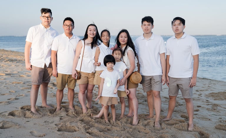 Family beach portrait during a destination family photography session at The Mulia Bali