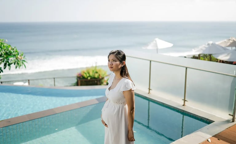 Parents sharing a quiet moment by the pool during a family session at Anantara Uluwatu.