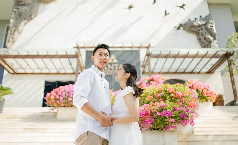 Couple sharing a quiet maternity moment during a family photography session at Anantara Uluwatu.