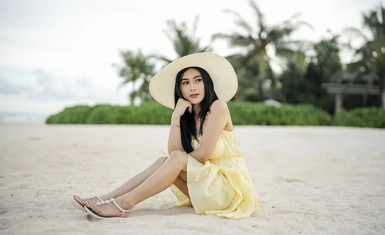 Elegant woman's beach portrait at The Apurva Kempinski Bali