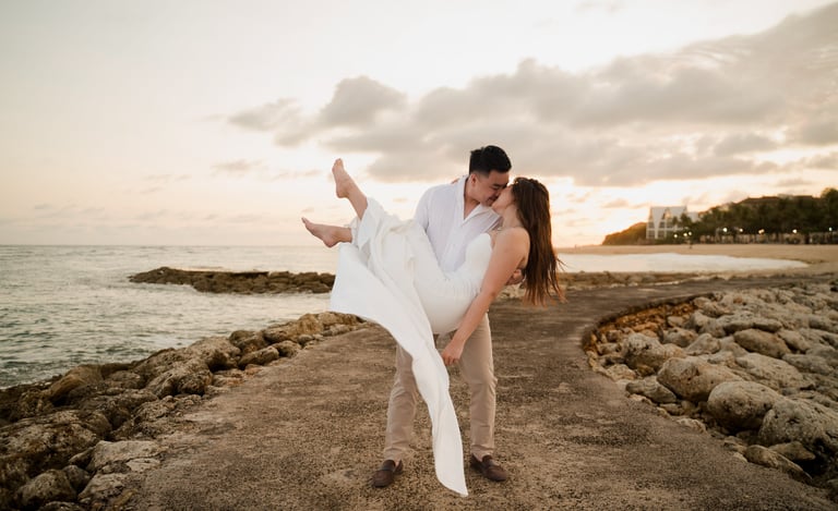 Couple embracing during golden sunset beach prewedding photoshoot at Apurva Kempinski Bali