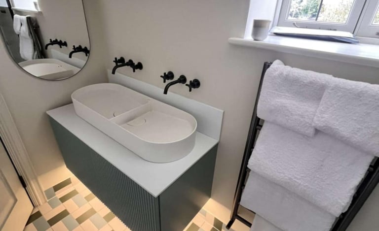 stylish bathroom with double sinks and chrome mixer taps in Evesham
