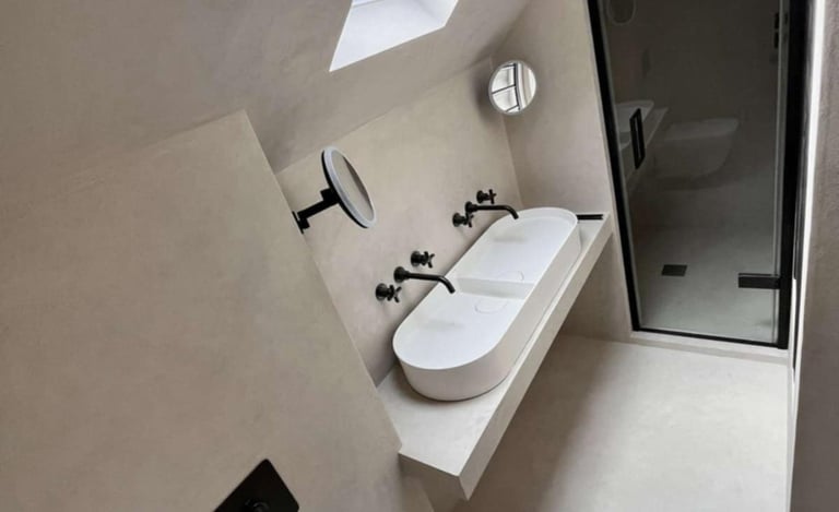 Fully tiled contemporary bathroom with bathtub and vanity unit fitted by PBP Services