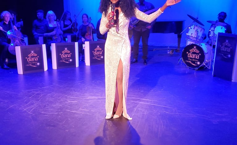 a woman in a white dress standing on a stage