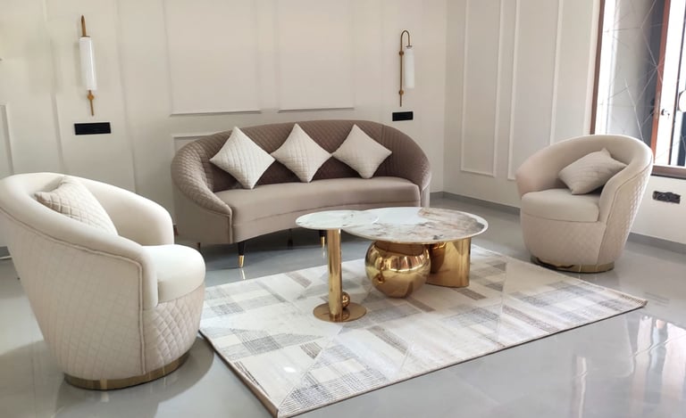 Living room interior design with three seater couch sofa two chairs. marble centre table neoclassic