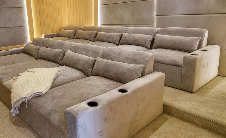Solo Home Decor custom theater sectional with plush reclined seats, cup holders, and warm lighting