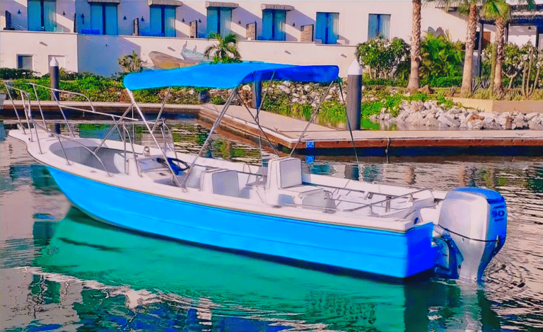 a boat in the water with a blue sky in the background