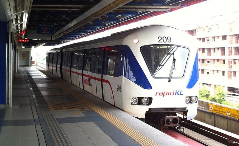  Light rail train at elevated station representing transit connectivity