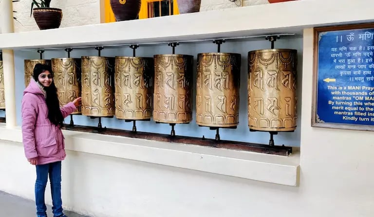 Tibetan prayer wheels at the Dalai Lama Temple in McLeod Ganj, Dharamshala, symbolizing peace, faith, and Buddhist tradition.