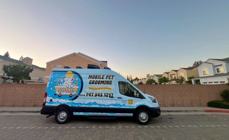 Fluff N Go mobile dog grooming van parked in a Los Angeles residential neighborhood