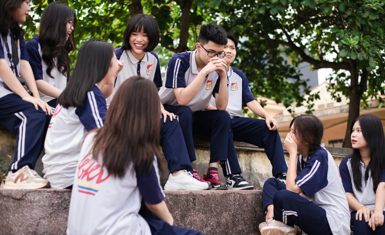 a group of young people sitting on steps