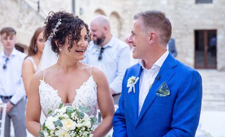 a bride and groom standing in front of a wedding ceremony