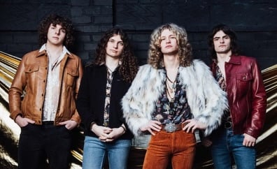 A 1970s style rock band with long hair wearing leather jackets and a faux fur coat.