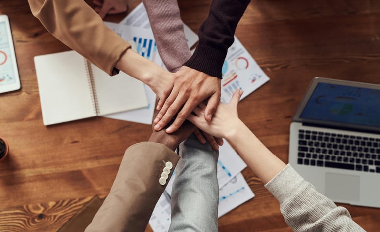 High/performing Team working together on a common goal