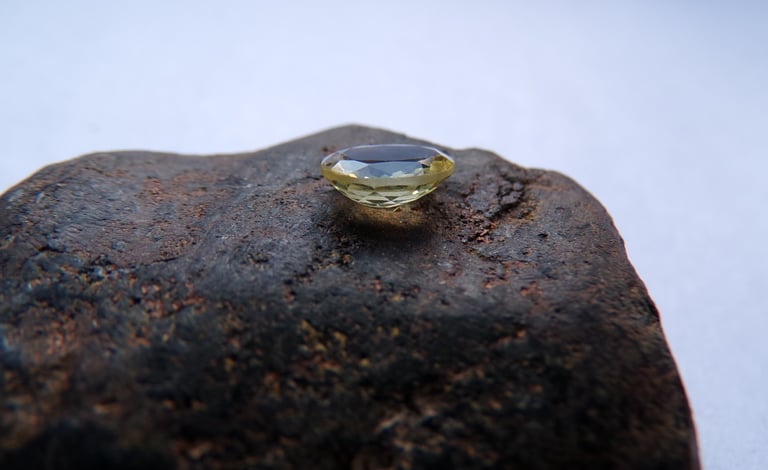 Chrysoberyl on top of rough, unpolished magnetite