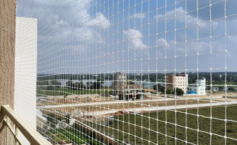 a balcony nets with a view of a city skyline