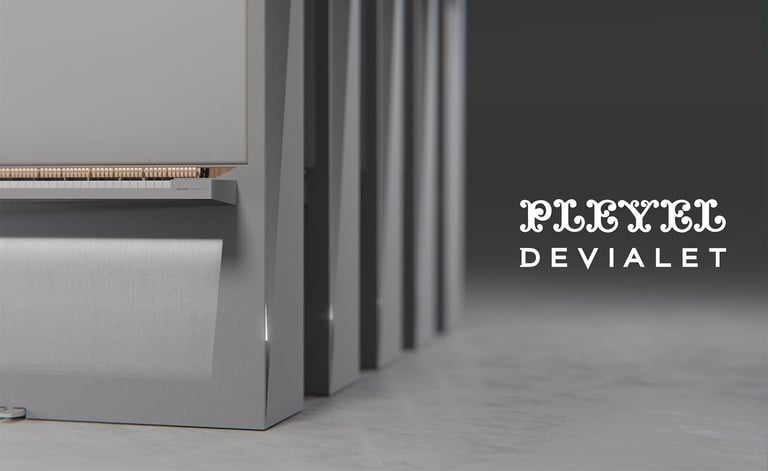 Close-up of a modern grey Pleyel Devialet piano design showing keys and sleek minimalist aesthetic.