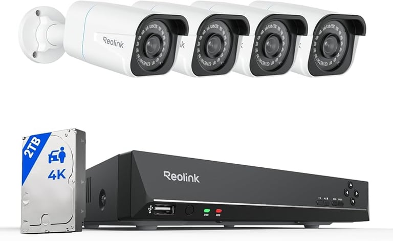 Reolink 4K security camera system with four white outdoor bullet cameras, 2TB hard drive, and NVR recorder.