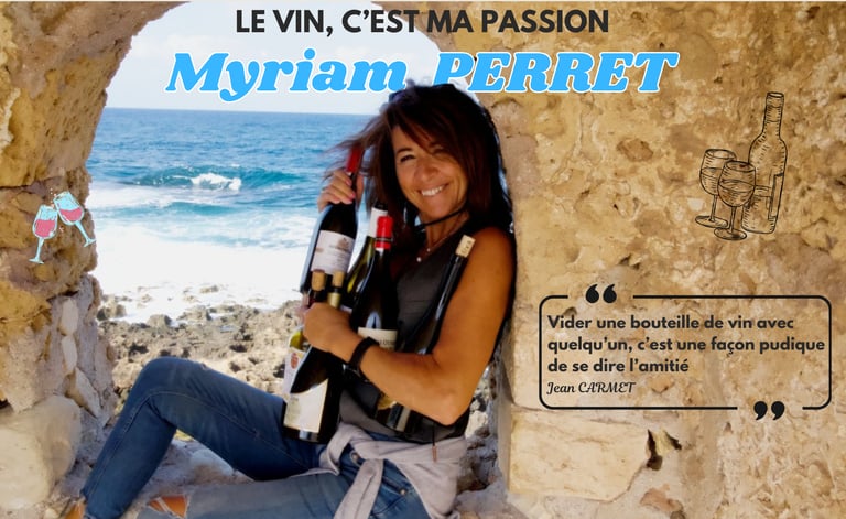 a woman sitting on a stone wall with a greek bottle of wine