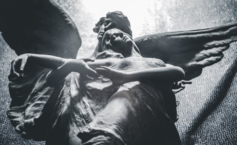 Two angels in stone. Luigi Boccardo-unsplash
