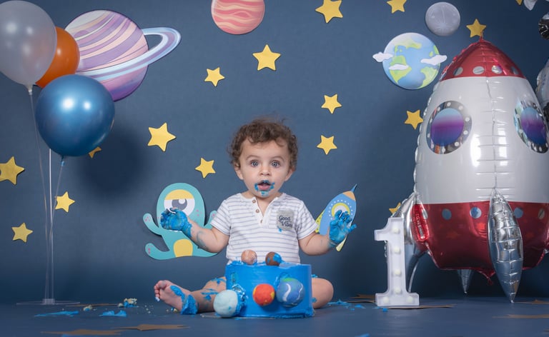a baby boy in a space themed photo shoot