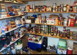 a pantry with shelves full of food and condiments
