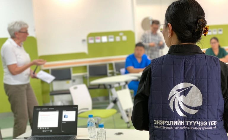 Professional educational seminar with a presenter leading a workshop for healthcare staff.