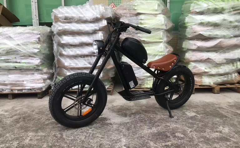 a motorcycle parked in front of a pile of bags