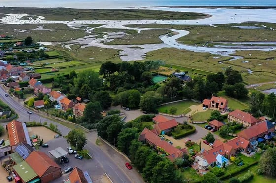 Brancaster Staithe village and marsh airial view