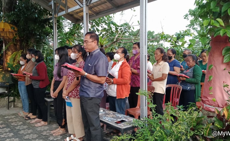 a group of people standing in line at a church
