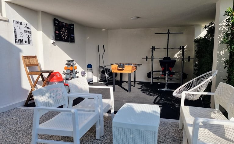 The photo shows an outdoor Fun and Fitness area with home equipment.