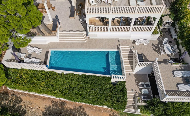 This picture shows the house and most of the yard taken from the air.