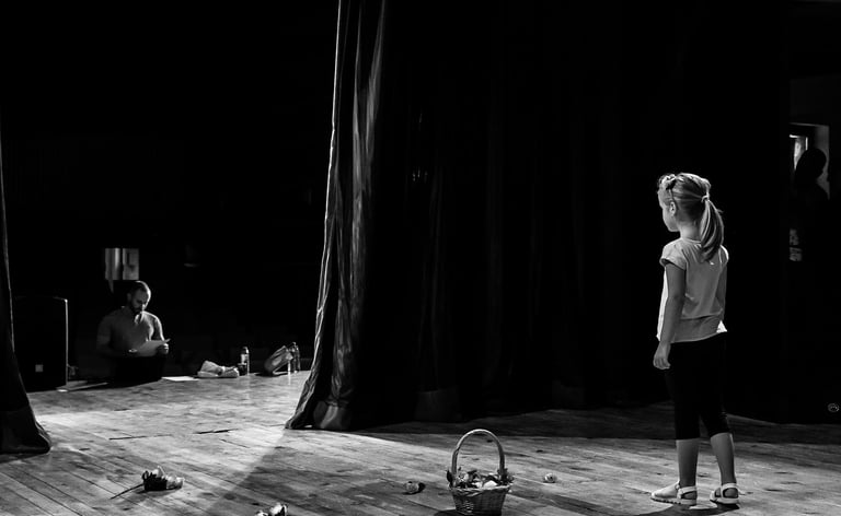 Young girl on stage waiting for her prompt to begin her performance