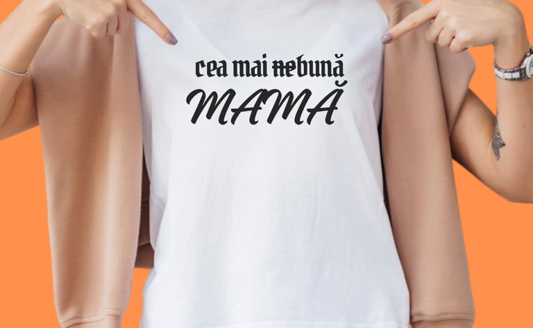 Woman wearing a white t-shirt with Romanian text 'cea mai nebună MAMA' against an orange background.