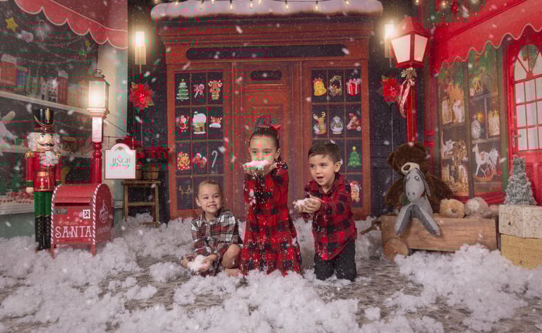 two children playing in a snow storm in a christmas card