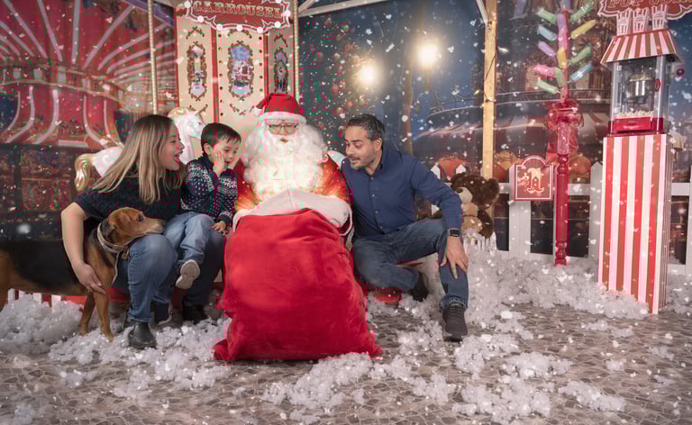 a family posing for a photo with santa claus claus claus claus claus claus claus claus
