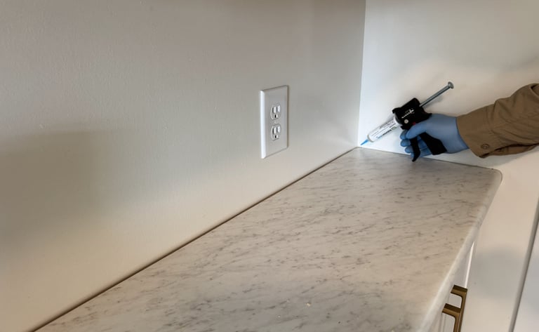 Ant gel bait being applied on kitchen counter top