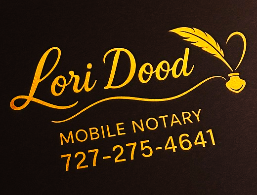 a business card with a gold foil foiled logo