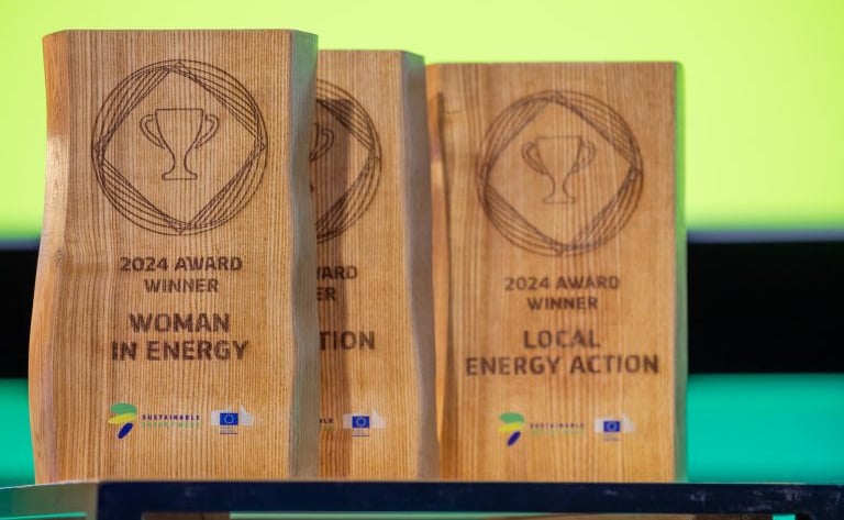 two wooden plaques with a woman in a white dress