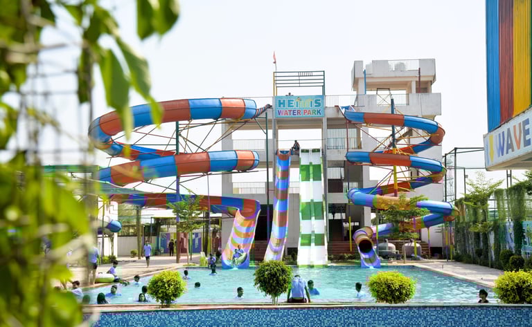 a water slider with a slider in the middle of a pool
