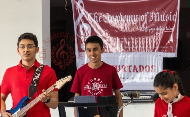 Young student artists performing together in Mumbai.