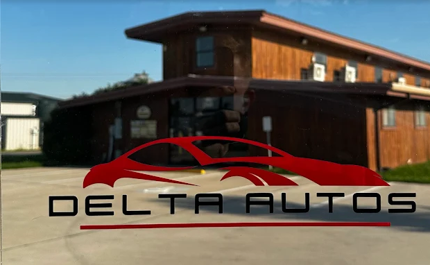 The building and logo of Delta Autos in Fort Worth