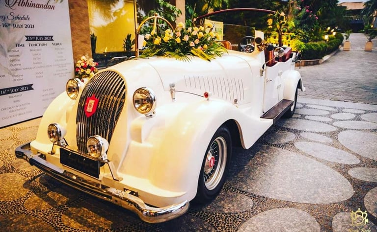 a vintage car with a bride and groomsmen