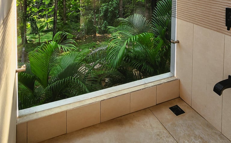 a bathroom with a large window and a view