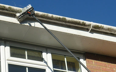 long reach brush cleaning gutters and soffits at C-Thru, Exeter.