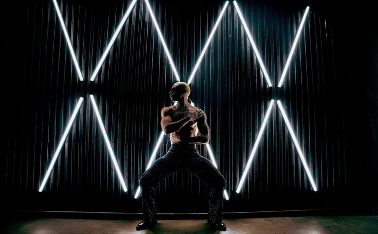 Roy Covington shirtless pressed against the wall