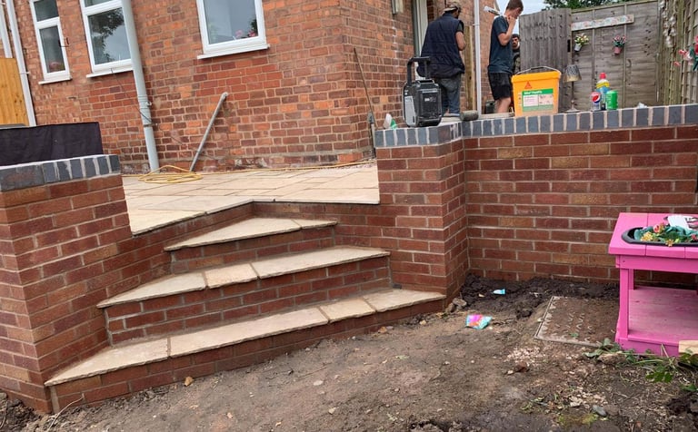 brick steps and wall installed by b r building and landscapes